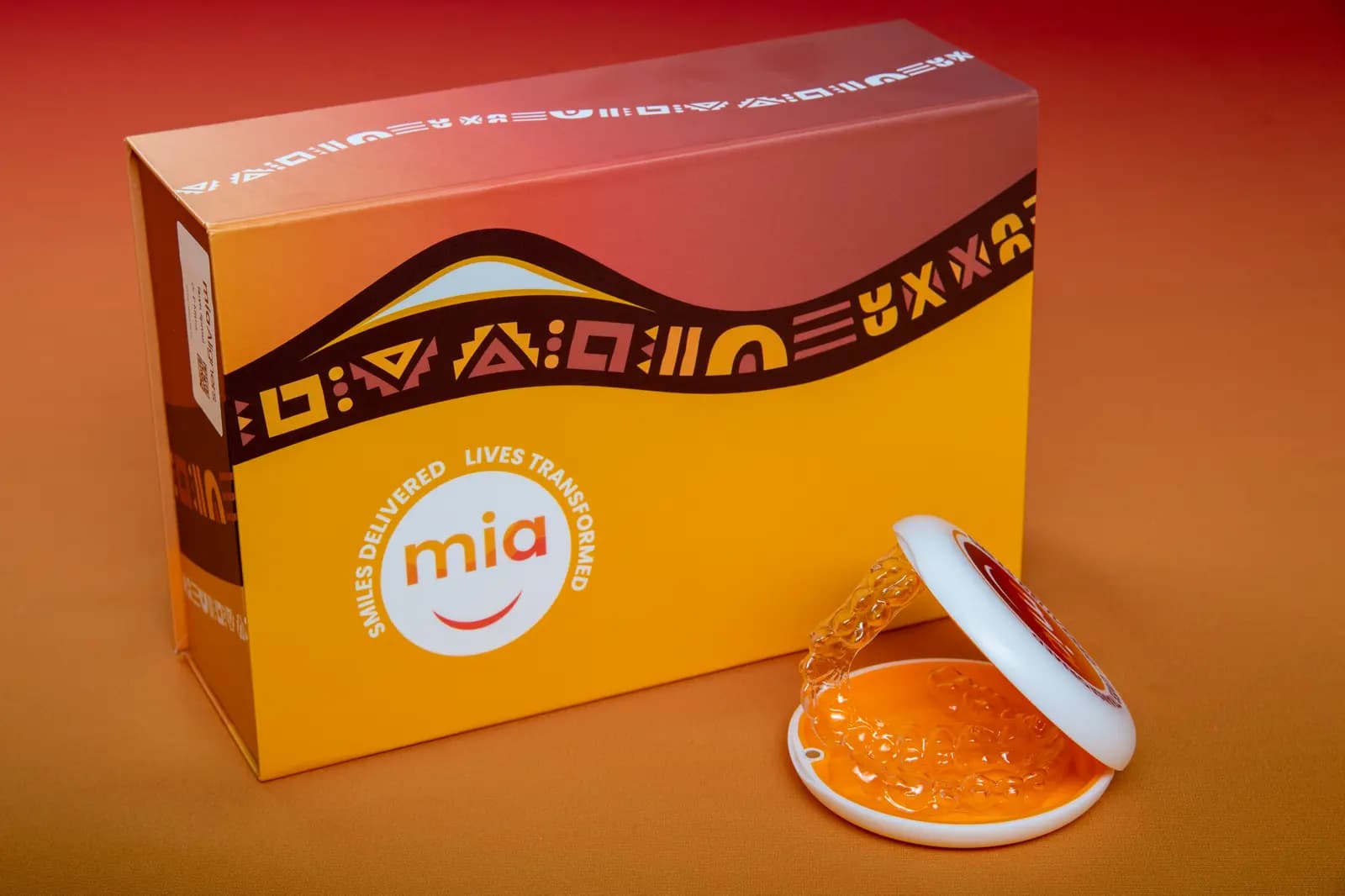 Orange Mia aligner box with an open case