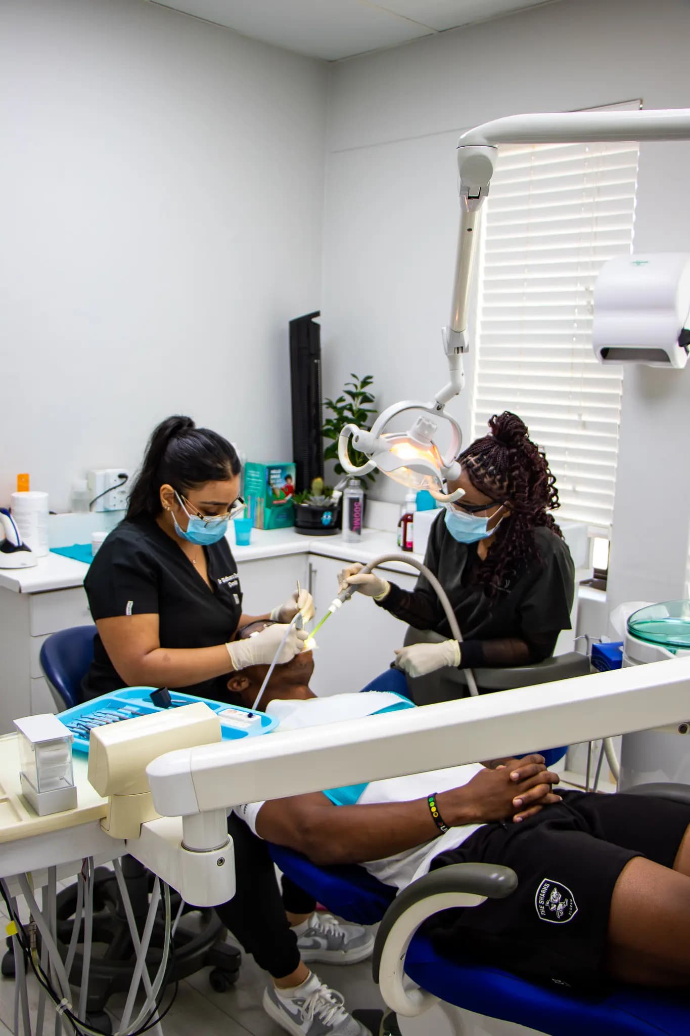 Wide surgery with a dentist and assistant treating a patient