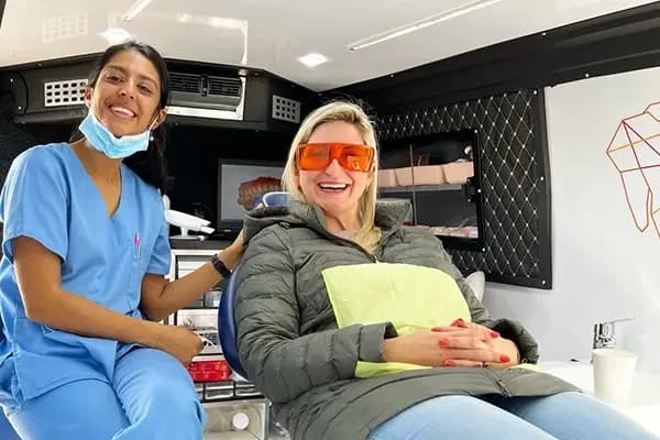 A patient in the chair inside the Mia Mobile van